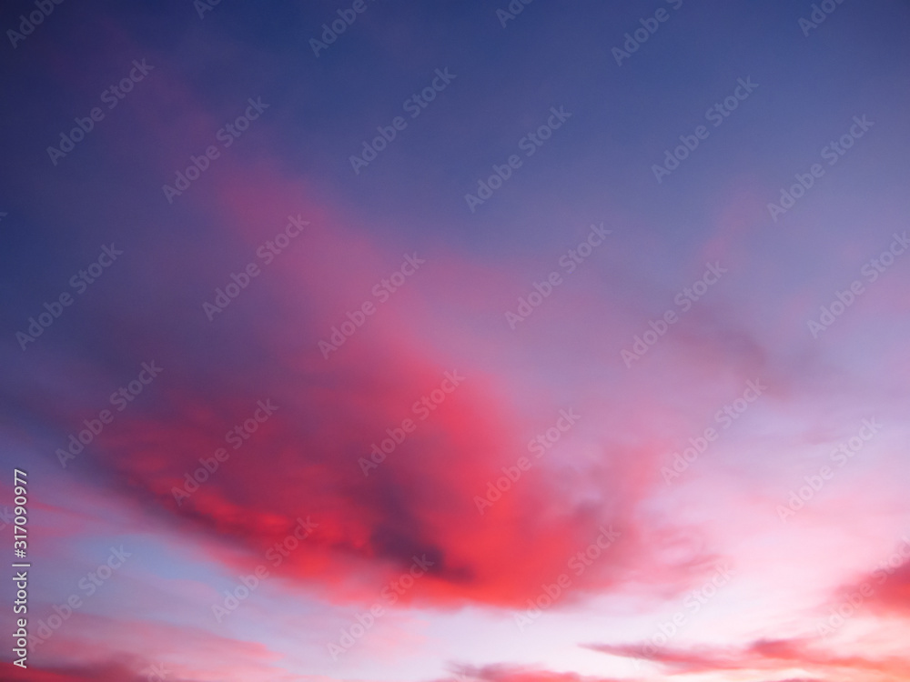 Dark blue sky with red clouds. 