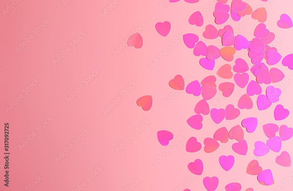 Abstract pink background with heart shaped confetti. Saint Valentine`s day concept.