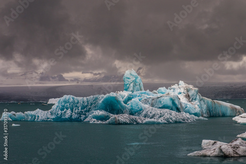 Waves of the Atlantic ocean off the southern coast of Iceland, raging elements, foaming water. photo