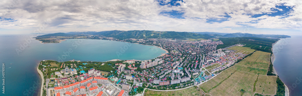 Gelendzhik resort-shooting from a quadrocopter. 180-degree panorama from the sea. You can see the Gelendzhik Bay, the entire city, and the Caucasus mountains in the background.