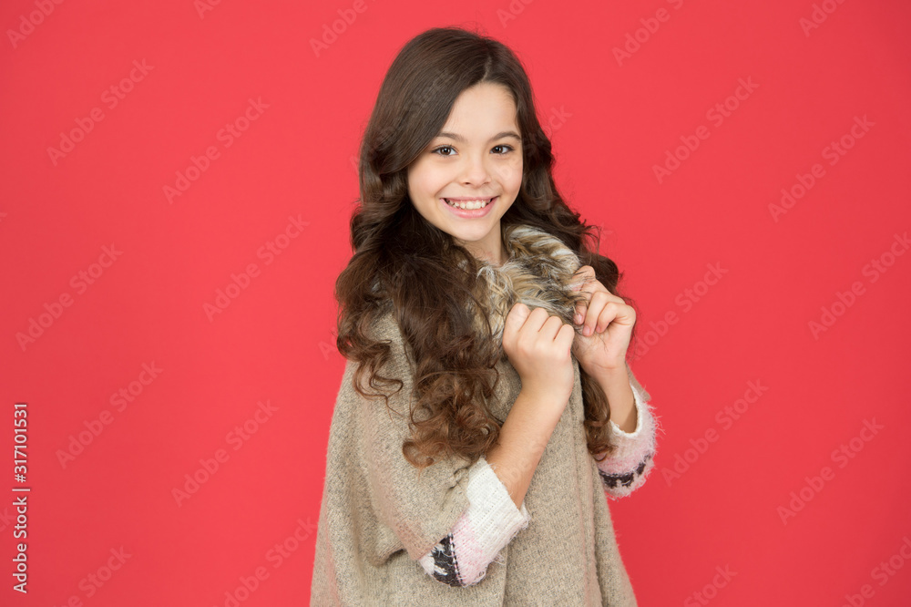 beauty and elegance. little beauty smiling on red background. hairdresser concept. warm sweater for cold season. kid fashion style. happy childhood. child pose for photo. pretty girl long curly hair beauty and elegance. little beauty smiling on red background. hairdresser concept. warm sweater for cold season. kid fashion style. happy childhood. child pose for photo. pretty girl long curly hair