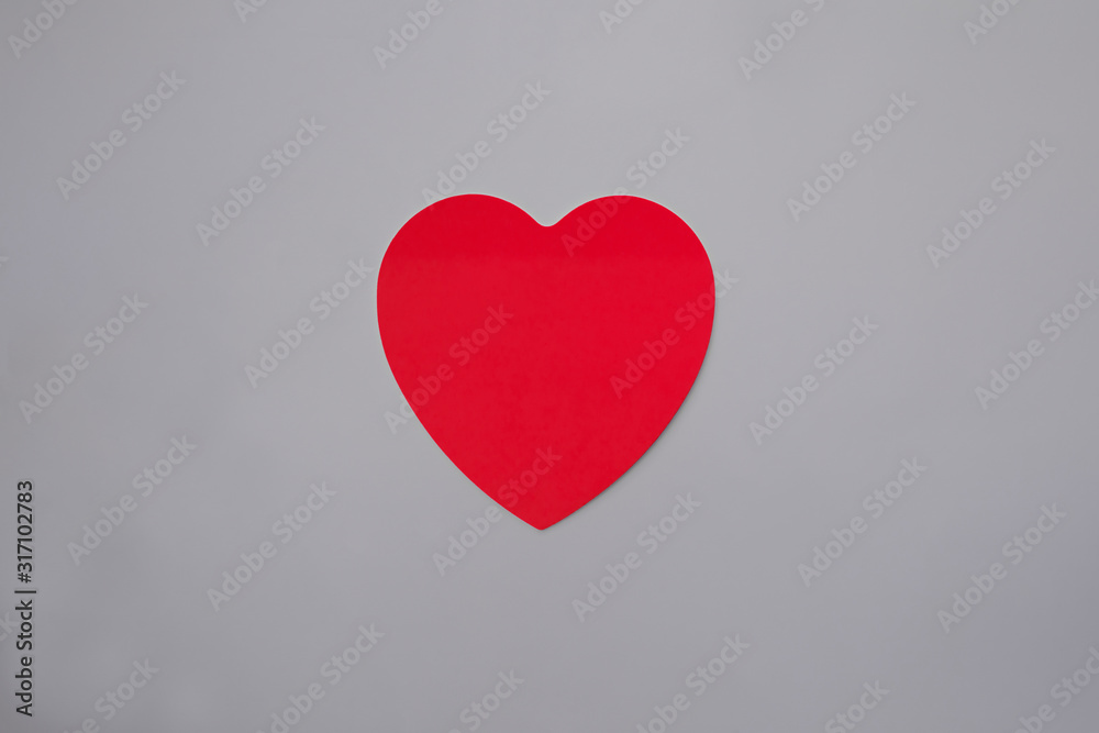 Red heart in gray background.