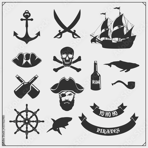 Set of pirate icons, emblems and design elements. Ship, anchor and Jolly Roger.