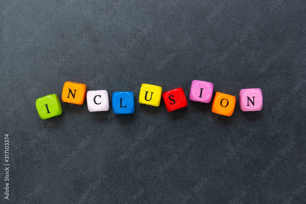 Inclusion text of multi colored cubes on dark background. Inclusive social concept. Inclusion text of multi colored cubes on dark background. Inclusive social concept.