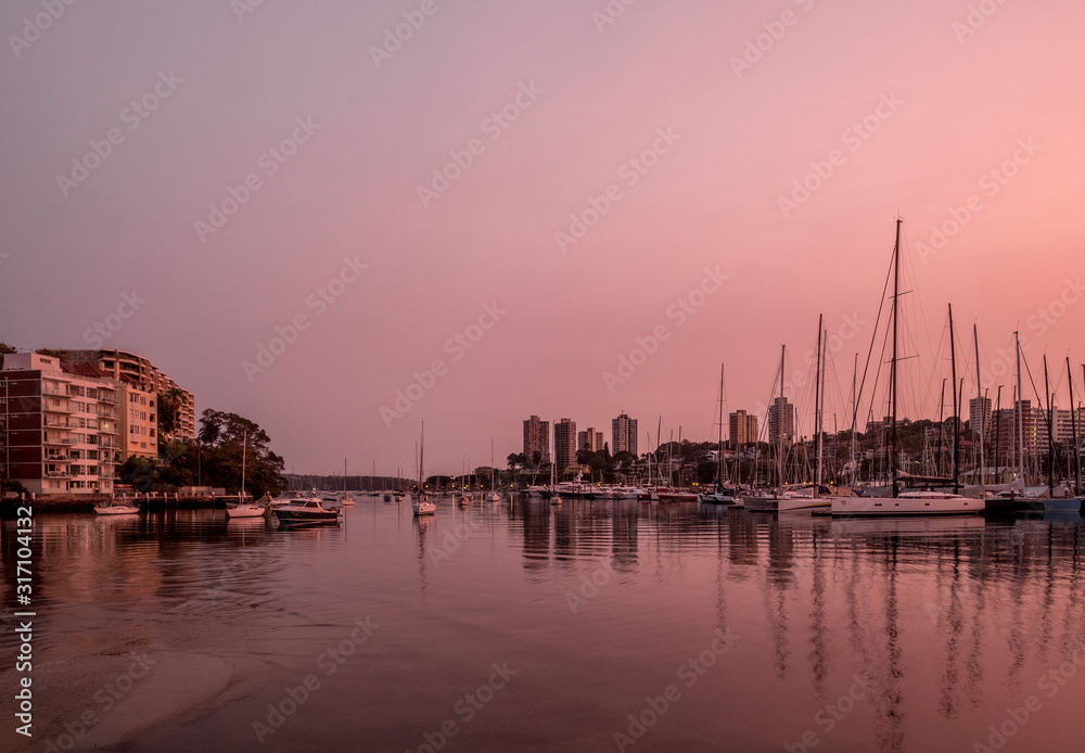 Orange pink dwan on sydney harbour