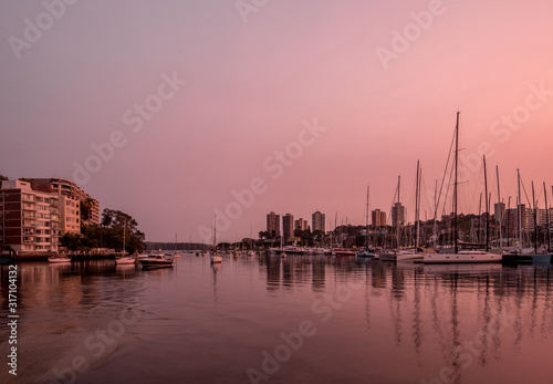 Orange pink dwan on sydney harbour