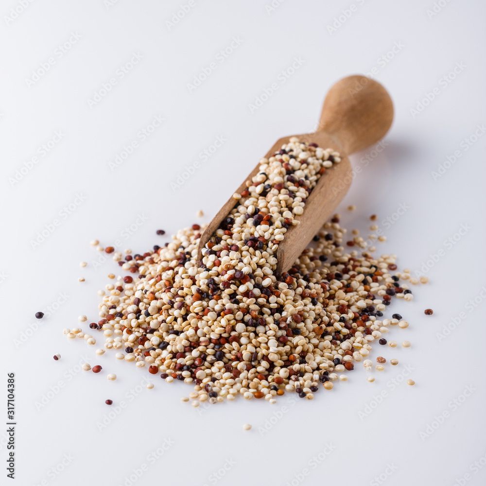 mix of quinoa grains on white acrylic background mix of quinoa grains on white acrylic background