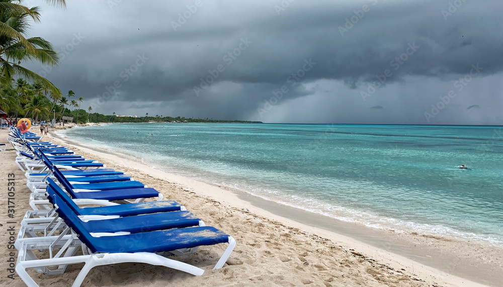 Cloudy day on the beach. Rain on the coast during a beach holiday ...