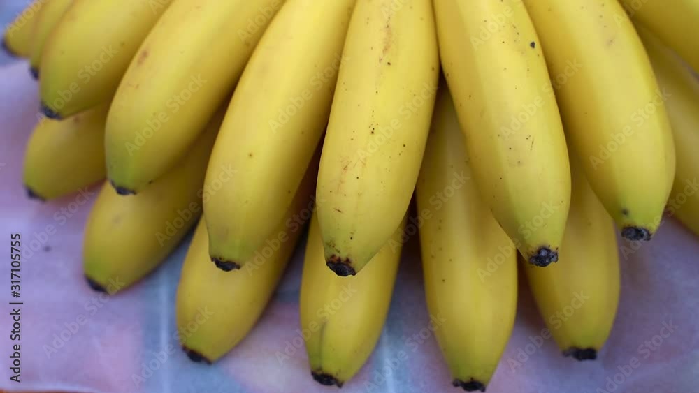 small yellow ripe bananas in the store small yellow ripe bananas in the store