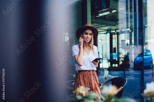 Stylish woman listening to music in cafe © BullRun