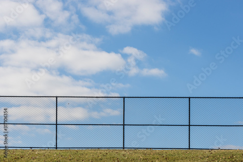 a fence on a blue sky