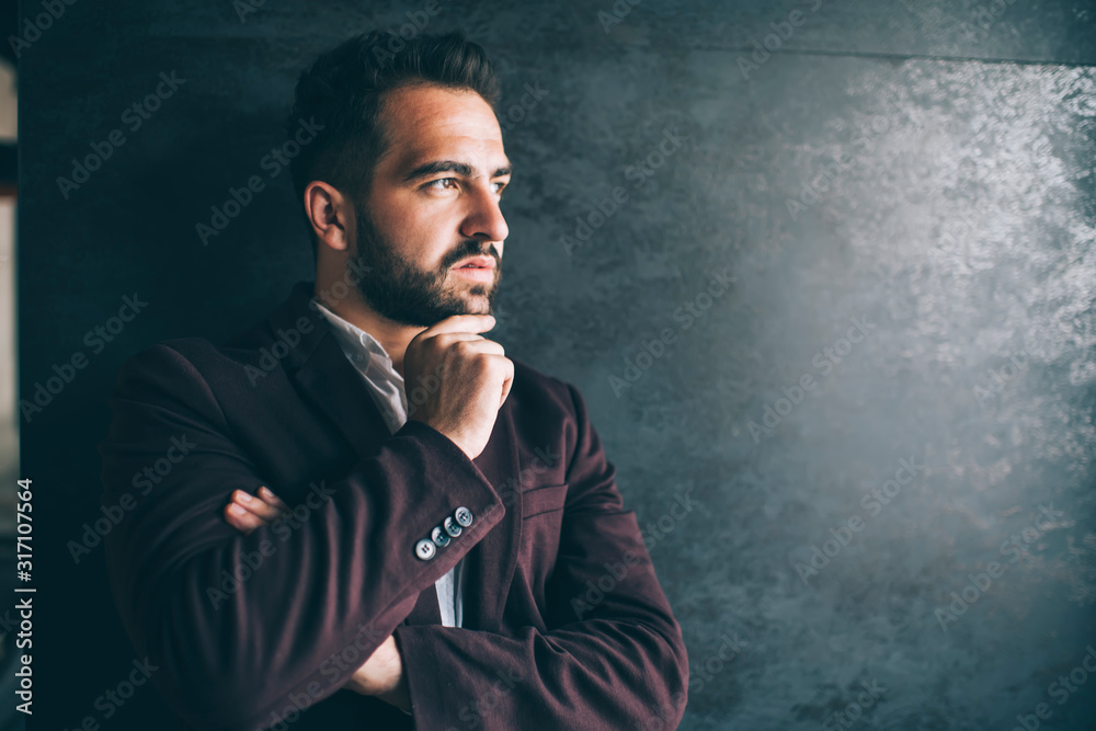 Confident entrepreneur standing at work space
