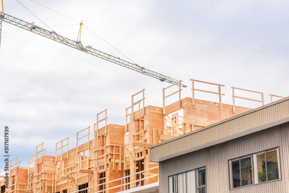 Building under construction. The site with crane.