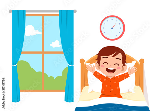 happy cute little kid boy wake up in the morning