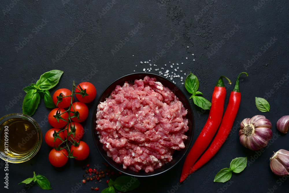 Homemade minced meat with vegetables and spices. Top view with copy space. Homemade minced meat with vegetables and spices. Top view with copy space.