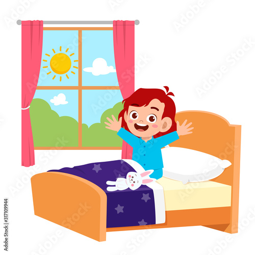 happy cute little kid girl wake up in the morning