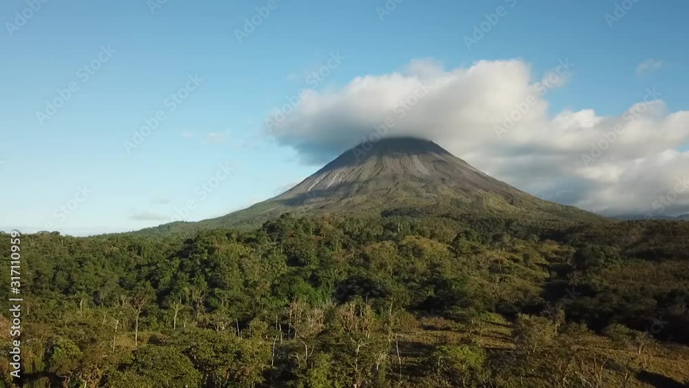 Beautiful aerial shot of the active Arenal Volcano in Costa Rica on a sunny day. Drone footage. Beautiful aerial shot of the active Arenal Volcano in Costa Rica on a sunny day. Drone footage.
