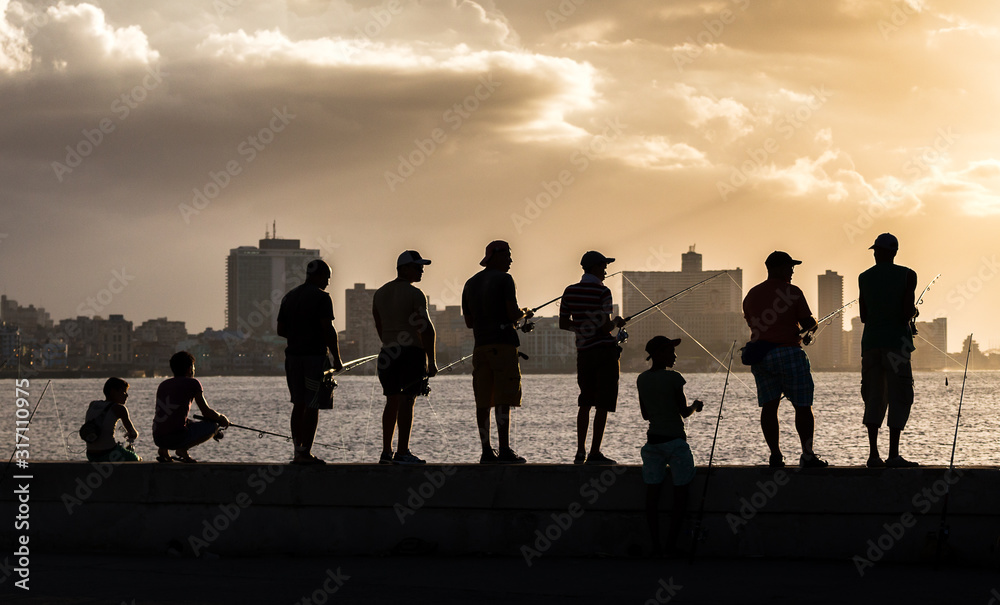 Fishing off the Malecon at sunset