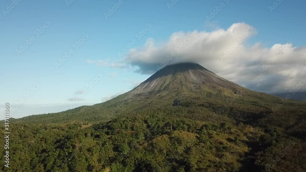 Beautiful aerial shot of the active Arenal Volcano in Costa Rica on a sunny day. Drone footage. Beautiful aerial shot of the active Arenal Volcano in Costa Rica on a sunny day. Drone footage.