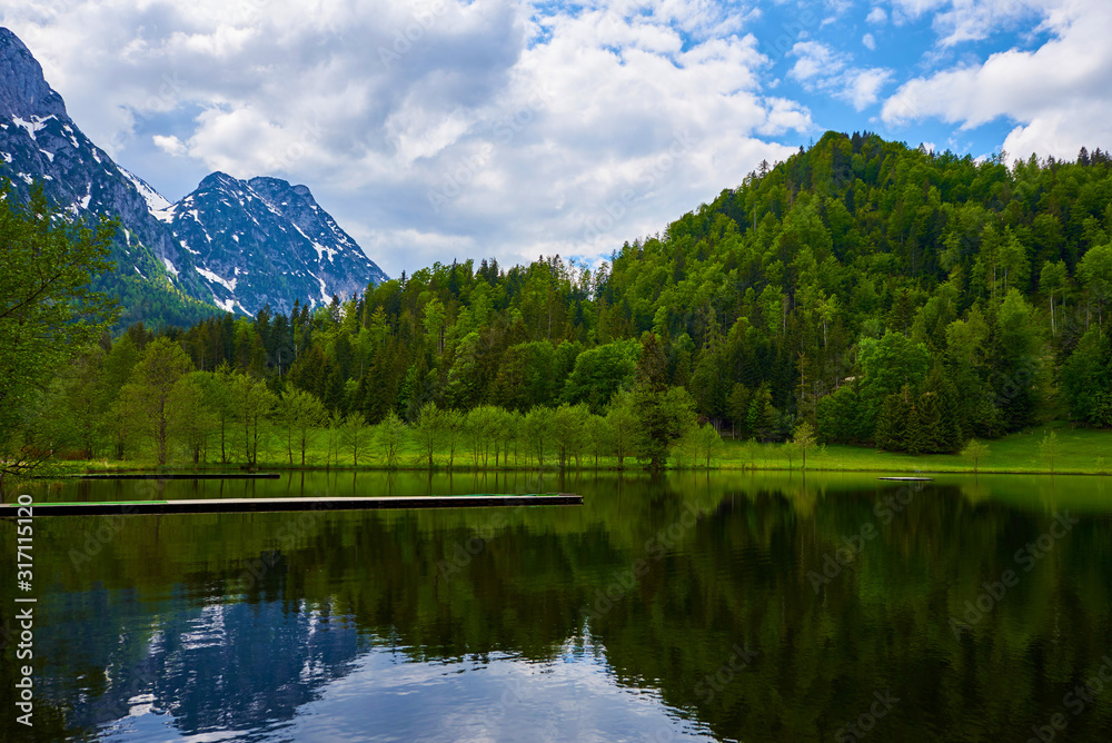 Wooden pier near of lake Sommersberg in the Austrian Alps. 