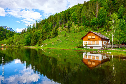 Traditional mountain house in Austrian Alps near of lake Sommersberg