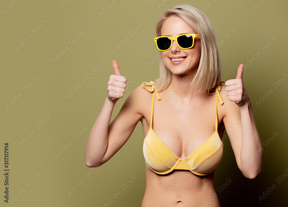 Beautiful blonde woman in bikini and sunglasses Beautiful blonde woman in bikini and sunglasses