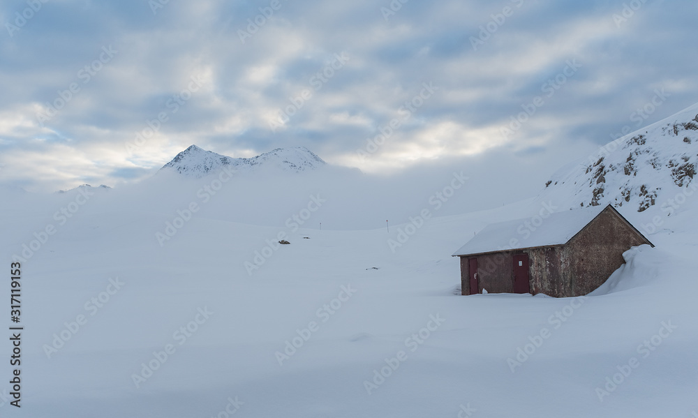 Small cabin and mountain in a gelid morning Small cabin and mountain in a gelid morning
