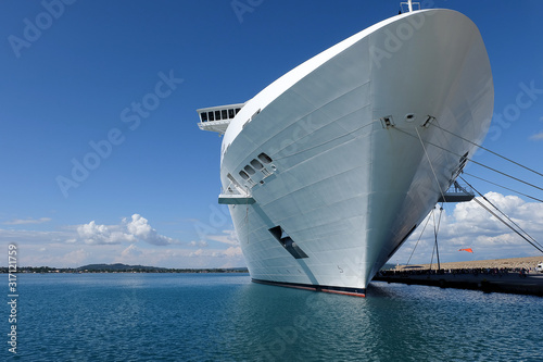Big cruise ship docks at port cruise terminal © nbnserge