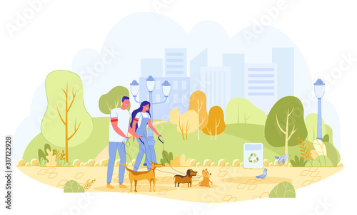 Man and Woman Volunteers Walking Dogs in Park
