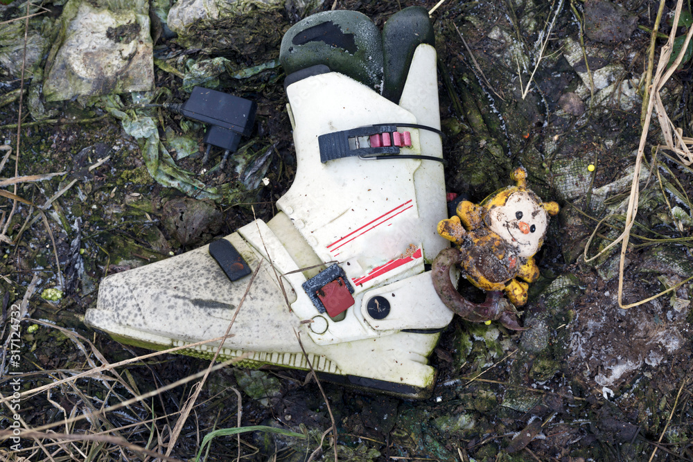 ski boot in the trash