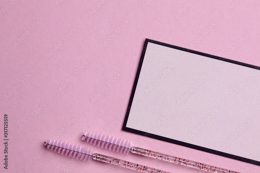 Mockup of visit card and brush for combing eyelashes of beauty salon. beauty fashion. Mockup of visit card and brush for combing eyelashes of beauty salon. beauty fashion.