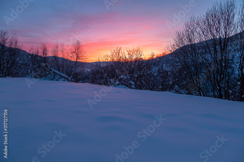 Winter sunset with snow, Lika, Croatia