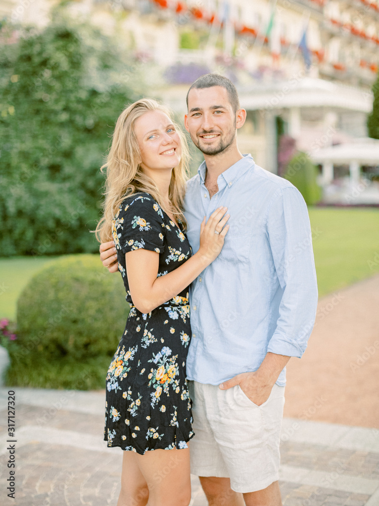 Smiling beautiful couple dating outdoors. Love. Summer in Italy Smiling beautiful couple dating outdoors. Love. Summer in Italy