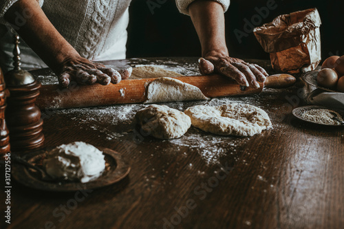 A Woman Prepares Homemade Braided Bread at Home