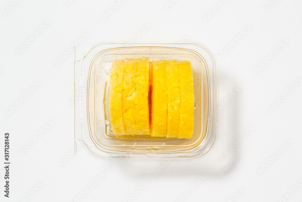 Use less plastic! Ananas in plastic packaging isolated on white ground. Symbol for environmental pollution done by the food industry Use less plastic! Ananas in plastic packaging isolated on white ground. Symbol for environmental pollution done by the food industry