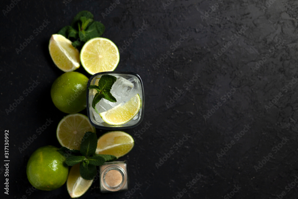 process of making homemade cocktail, flat with the ingredients for mojito on a black background, a refreshing summer cocktail process of making homemade cocktail, flat with the ingredients for mojito on a black background, a refreshing summer cocktail
