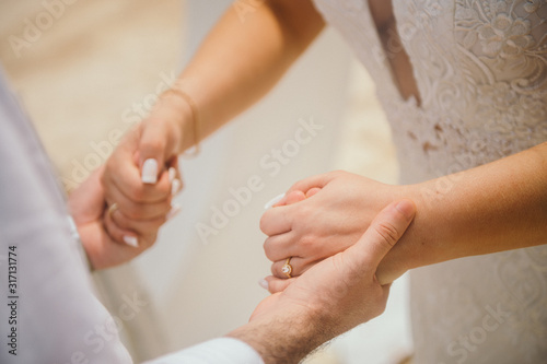 Holding hands during the ceremony