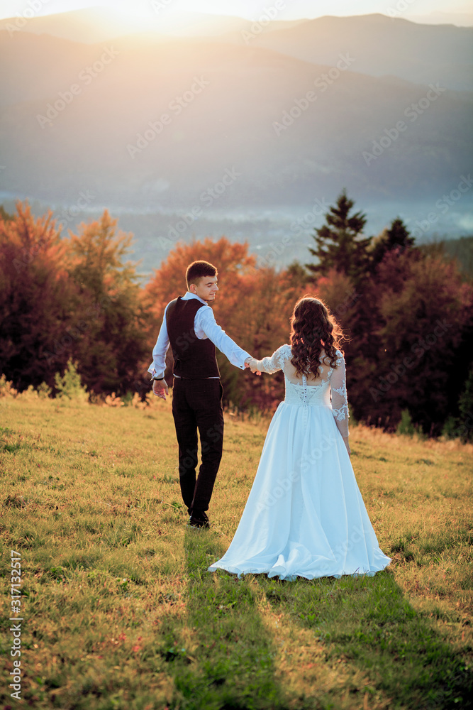 Bride and Groom at Sunset Romantic Married Couple Bride and Groom at Sunset Romantic Married Couple