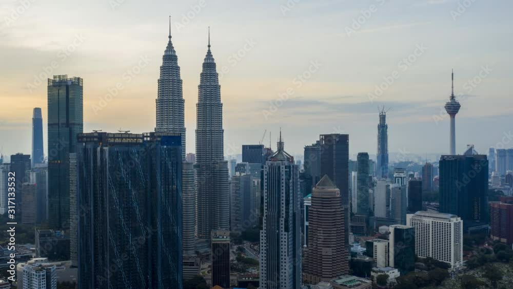Kuala Lumpur, Malaysia - December 28, 2019: 4k establishing b-roll cinematic shot of hyperlapse drone panning view of sunrise at Kuala Lumpur city skyline. Zoom in Kuala Lumpur, Malaysia - December 28, 2019: 4k establishing b-roll cinematic shot of hyperlapse drone panning view of sunrise at Kuala Lumpur city skyline. Zoom in