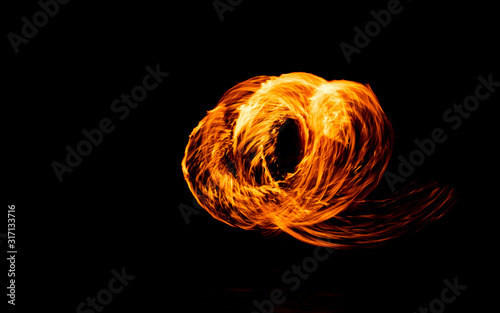 juggling with fire, show steel wool or swing fire and light on the beach dance man, Rotating lights
