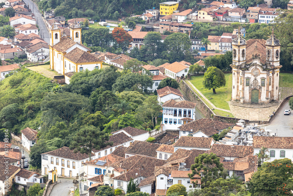 Church of Saint Francis of Assisi in colonial mining city of Ouro Preto in Minas Gerais, Brazil, and typical authenitc housing in the background and new neighbourhood behind