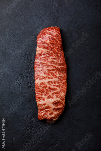 Raw fresh marbled meat Steak Wagyu beef on dark background