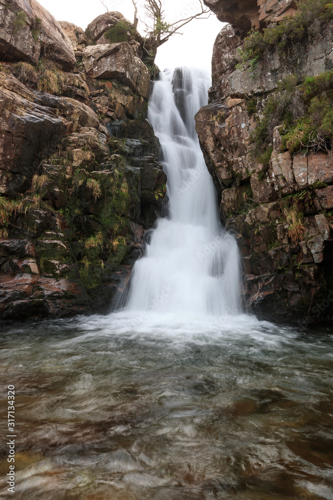 massive waterfall in the western part of Scotland, fresh water from the mountains in westen Scotland
