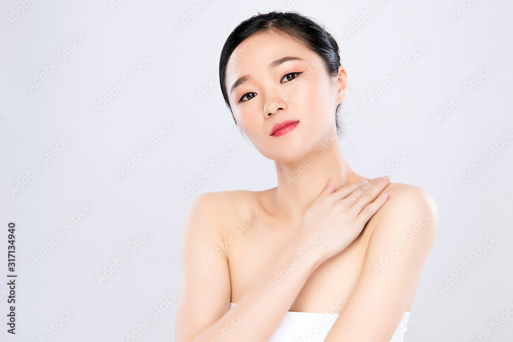 Beautiful Young Asian Woman with Clean Fresh Skin. Face care, Facial treatment, on white background, Beauty and Cosmetics Concept. Beautiful Young Asian Woman with Clean Fresh Skin. Face care, Facial treatment, on white background, Beauty and Cosmetics Concept.