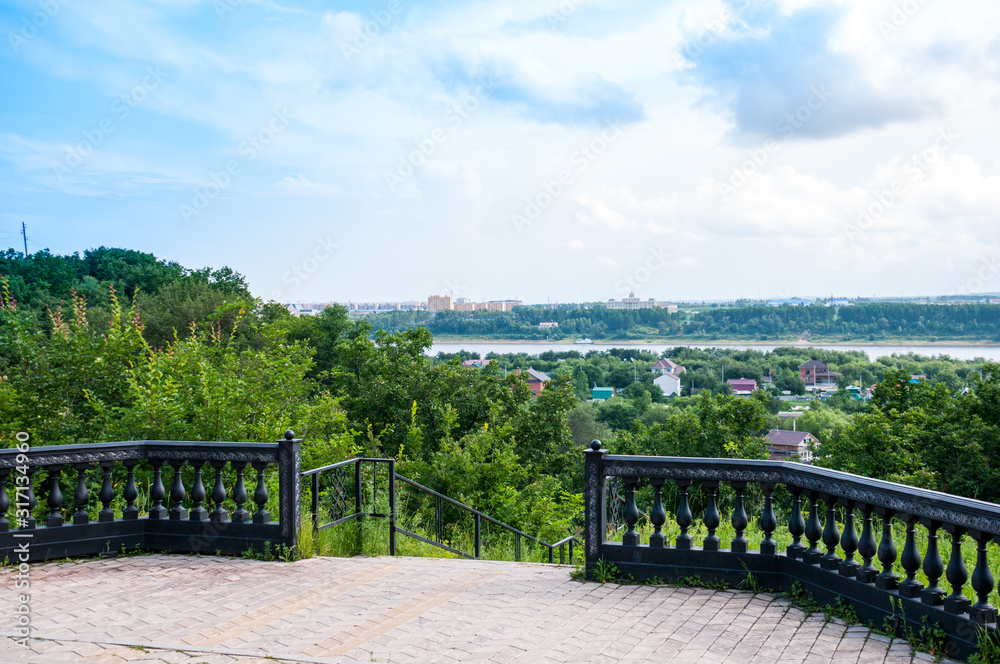 Russia, Blagoveshchensk, July 2019: summer Observation deck on the Amur river on the border of Blagoveshchensk and the Chinese city of Heihe Russia, Blagoveshchensk, July 2019: summer Observation deck on the Amur river on the border of Blagoveshchensk and the Chinese city of Heihe