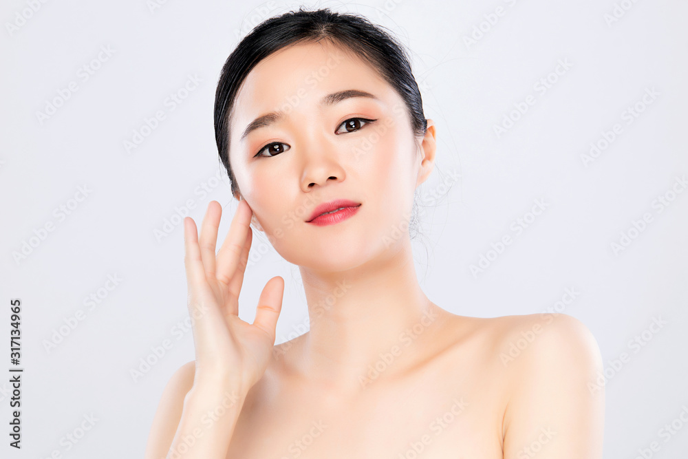 Beautiful Young Asian Woman with Clean Fresh Skin. Face care, Facial treatment, on white background, Beauty and Cosmetics Concept. Beautiful Young Asian Woman with Clean Fresh Skin. Face care, Facial treatment, on white background, Beauty and Cosmetics Concept.