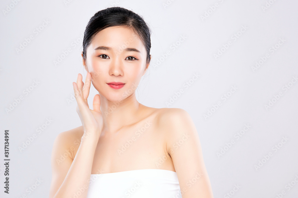 Beautiful Young Asian Woman with Clean Fresh Skin. Face care, Facial treatment, on white background, Beauty and Cosmetics Concept. Beautiful Young Asian Woman with Clean Fresh Skin. Face care, Facial treatment, on white background, Beauty and Cosmetics Concept.