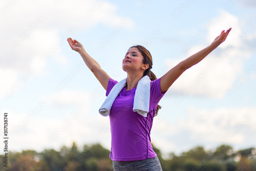 Active fitness woman with raised hands outdoor Active fitness woman with raised hands outdoor