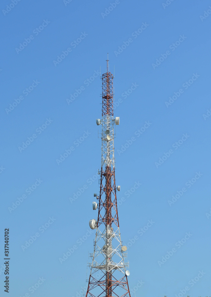 Telecommunication tower agaist blue sky