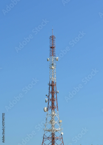 Telecommunication tower agaist blue sky
